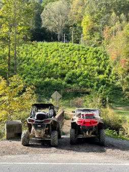Two SxS's in front of the Hatfield Cemetery where Devil Anse is buried.